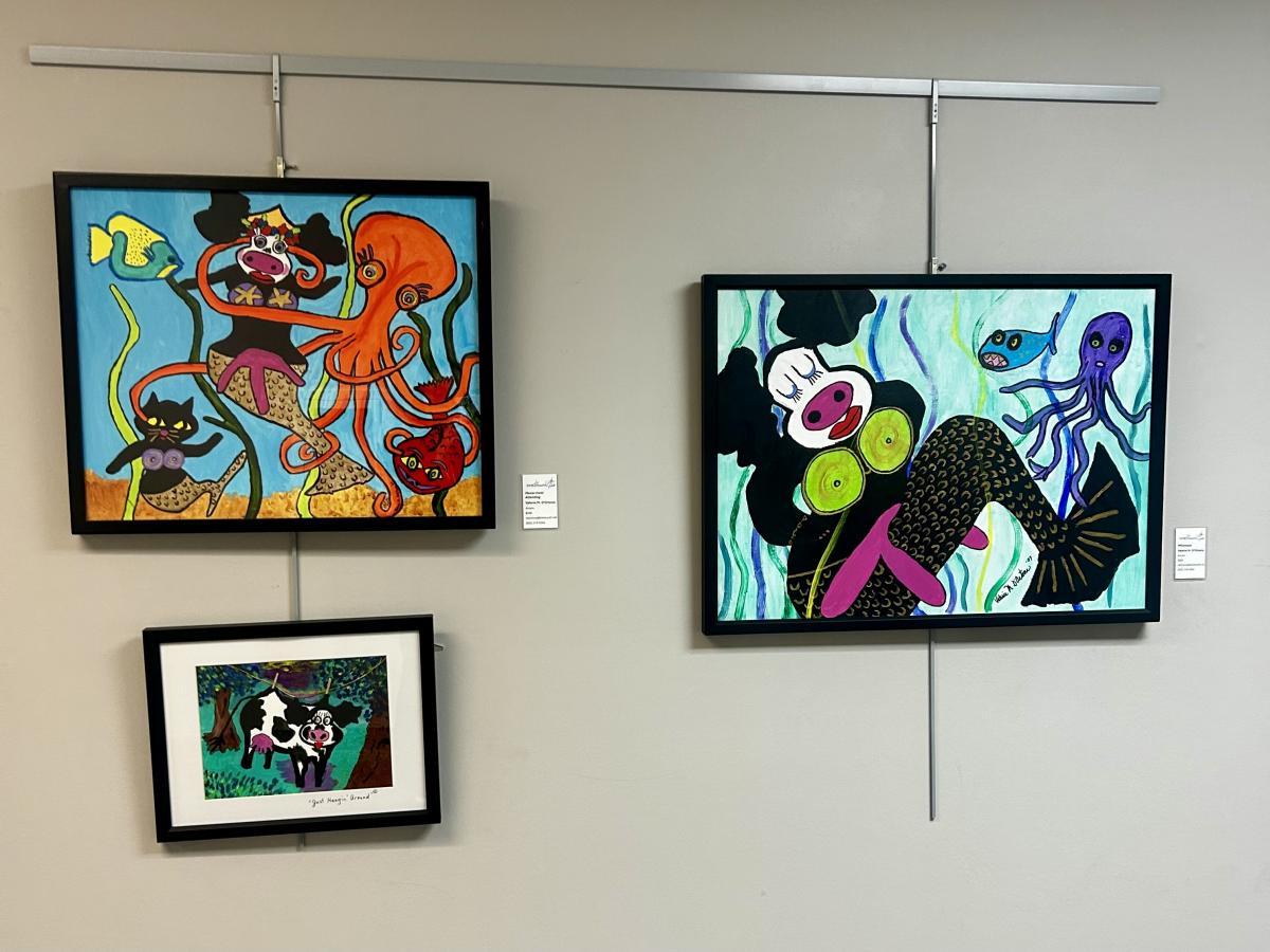 3 pieces of artwork on a wall. 