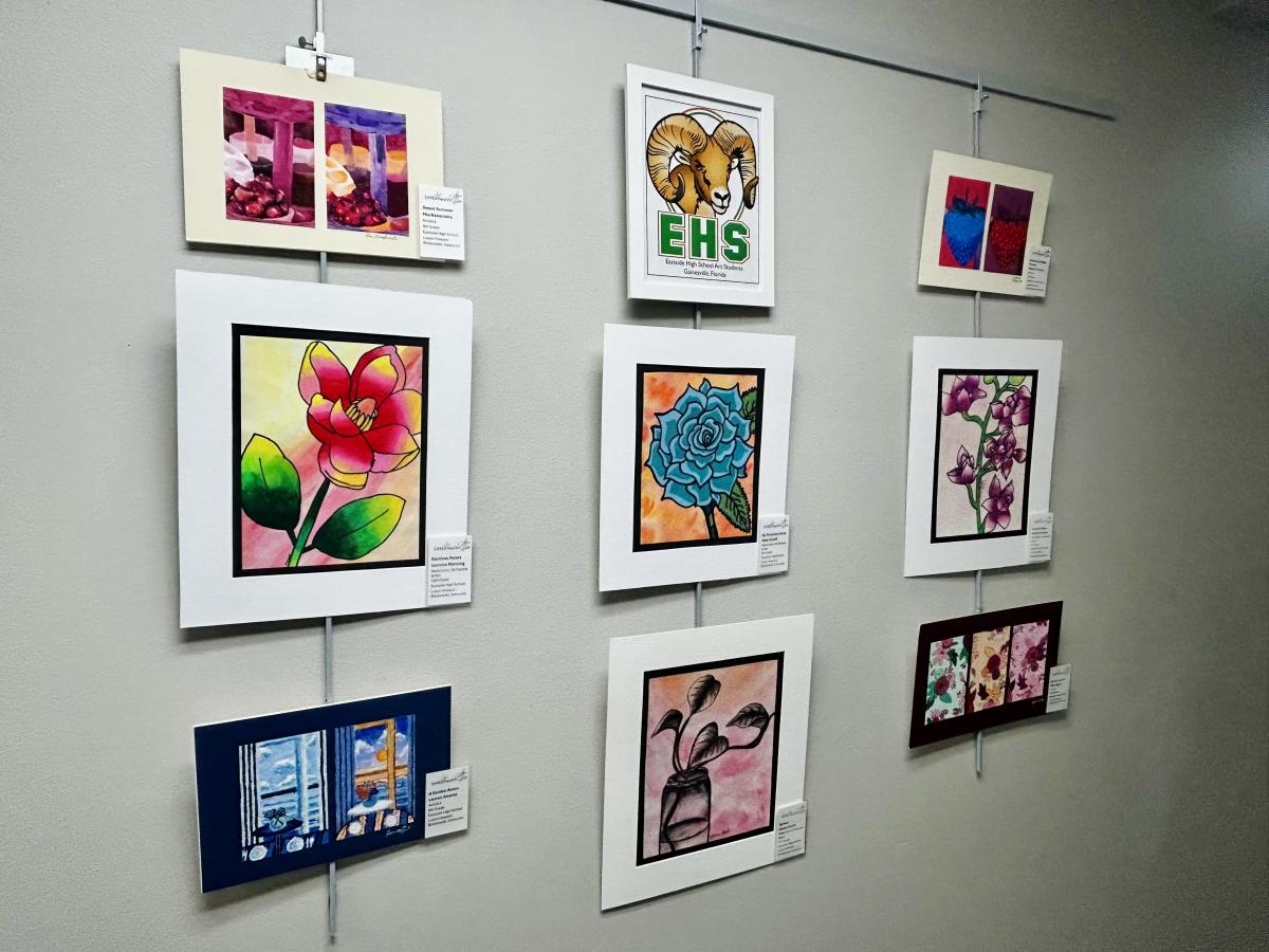 Three rows of colorful pieces of artwork