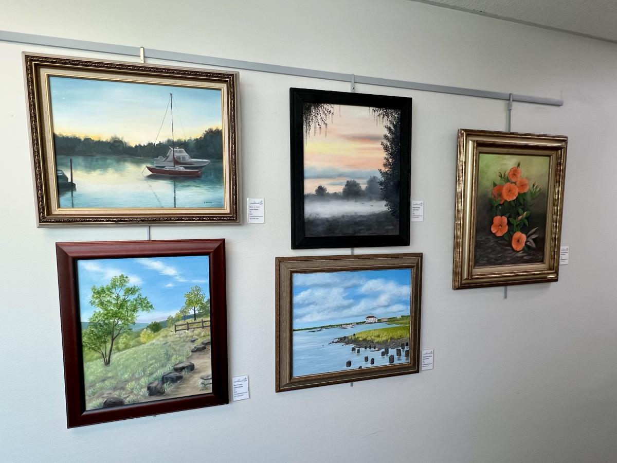 Five pieces of artwork featuring landscapes, water, and trees.